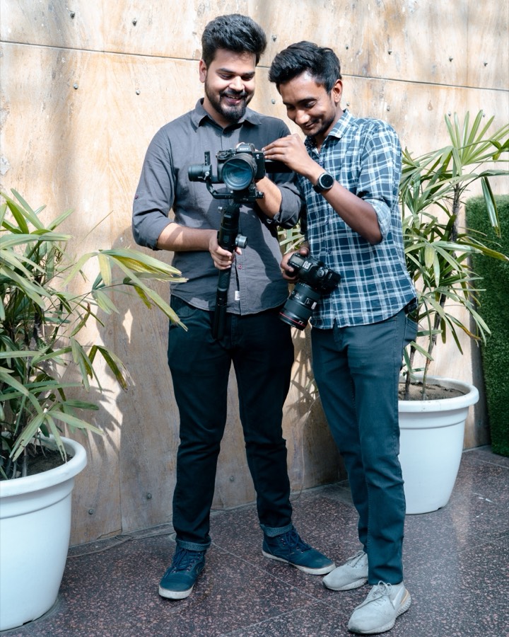 Saket checking a shot with a camera operator