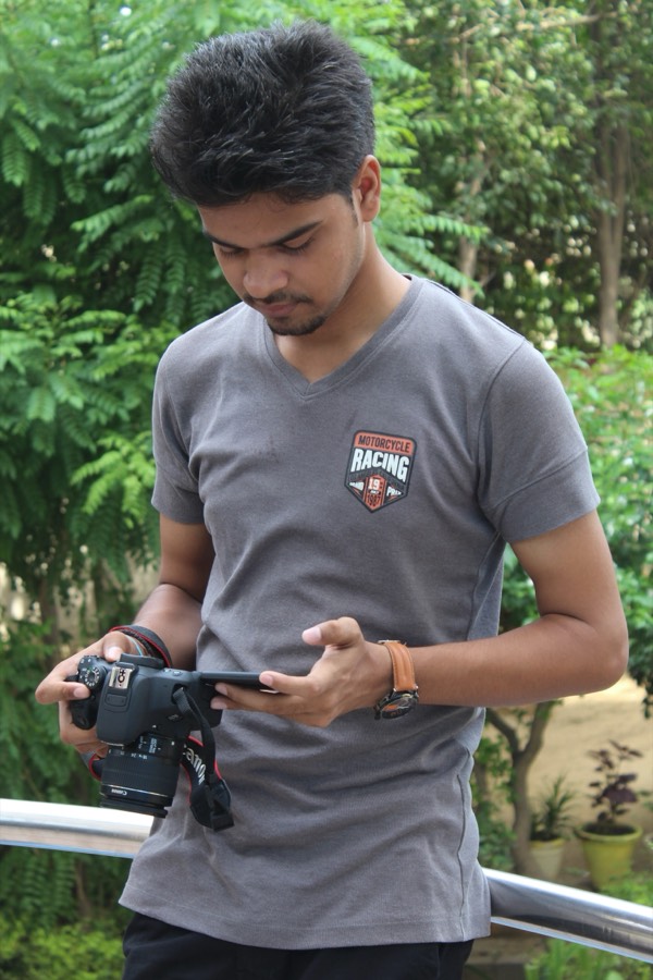 Saket reviewing a shot on camera