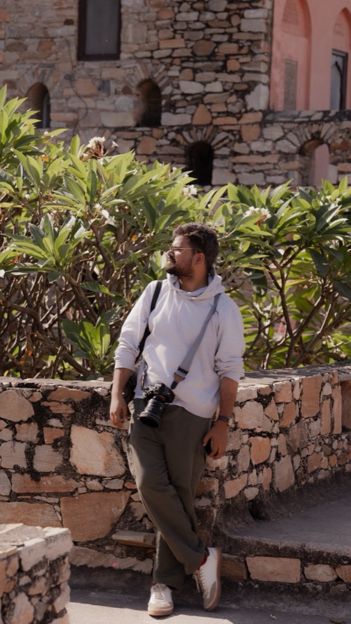 Saket walking through a heritage site with camera