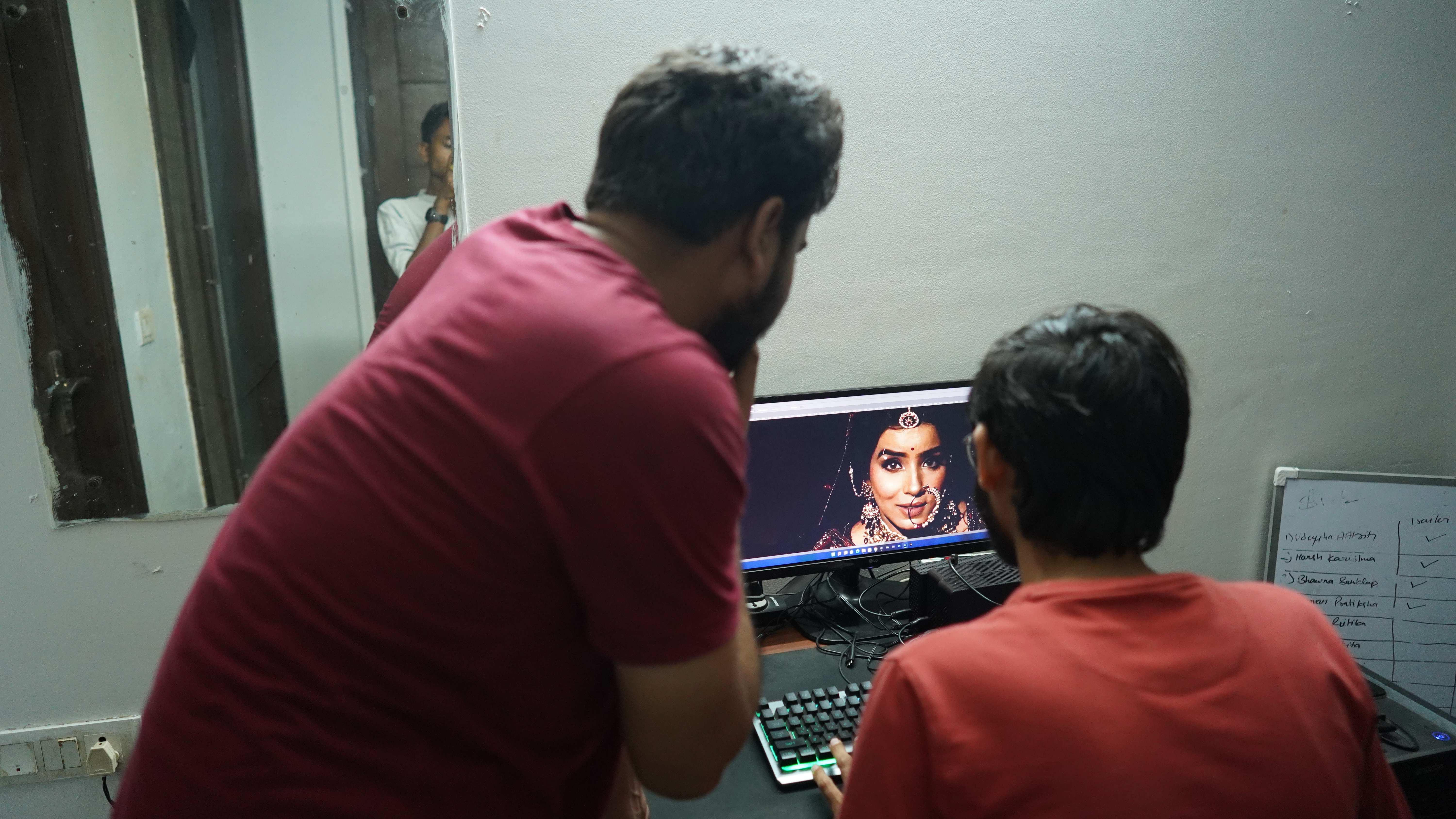 Cup of Stories team reviewing and editing wedding work together