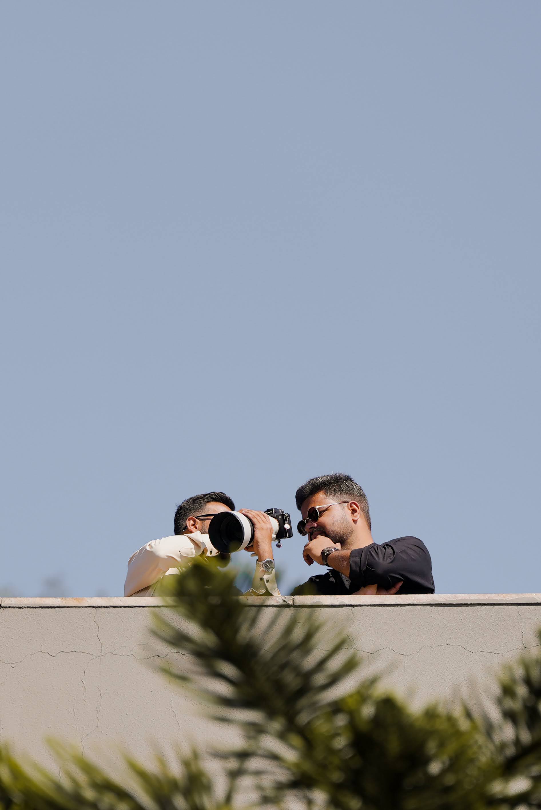 Saket Mishra reviewing a camera frame during a destination shoot